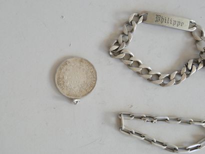 Set includes: 
- 2 silver identity bracelets....