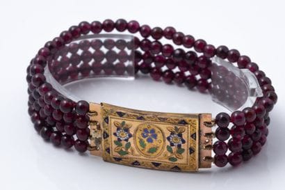 Bracelet with four garnet beads. The clasp...
