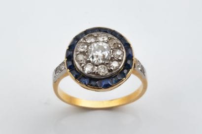Round ring featuring a center setting of...