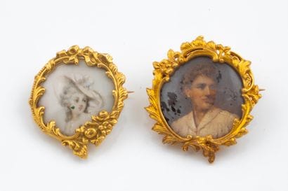 Two brooches with painted portraits, framed...
