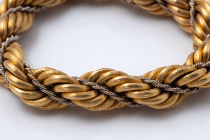 Two-strand twisted bracelet in yellow gold...
