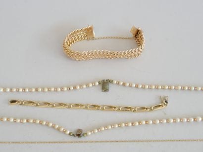 A set of costume jewelry and a lighter