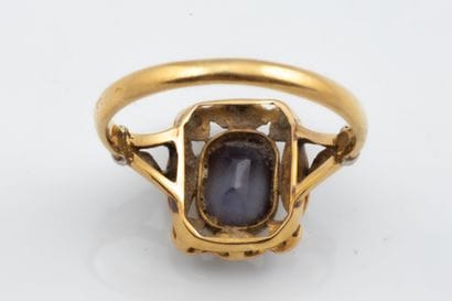 Rectangular ring set with a purplish imitation...