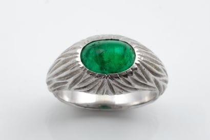 Platinum (850) dome ring set with a tinted...