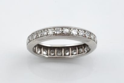 An oval-shaped, irregularly shaped platinum...