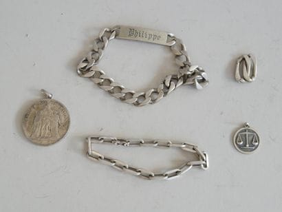 Set includes: 
- 2 silver identity bracelets....
