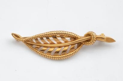 Openwork, tar-coated leaf brooch in yellow...