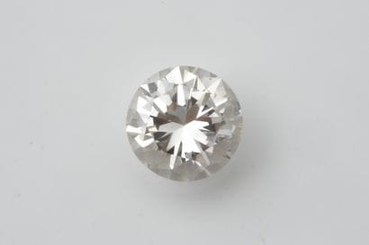 Brilliant-cut diamond on paper weighing approximately...