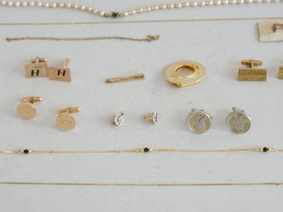 A set of costume jewelry and a lighter