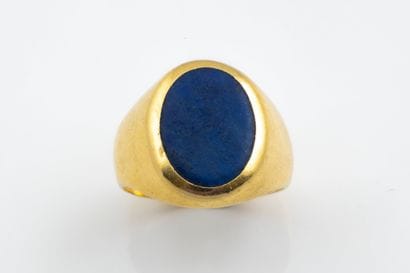 Oval signet ring featuring a lapis-effect...
