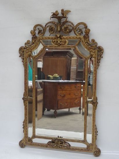 Miroir à parcloses dans un encadrement en...