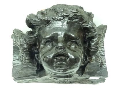 Tête d'angelot en bois naturel. XVIIIe siècle...