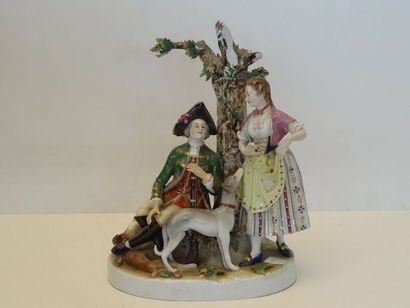 Groupe en porcelaine polychrome représentant...