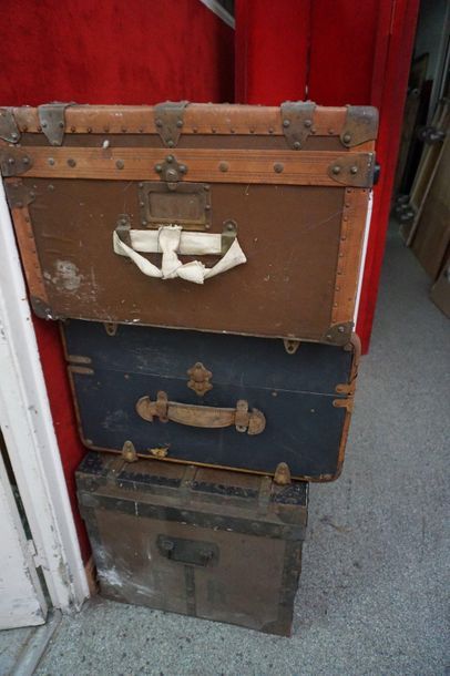 Reunion of three travel trunks, one of which...