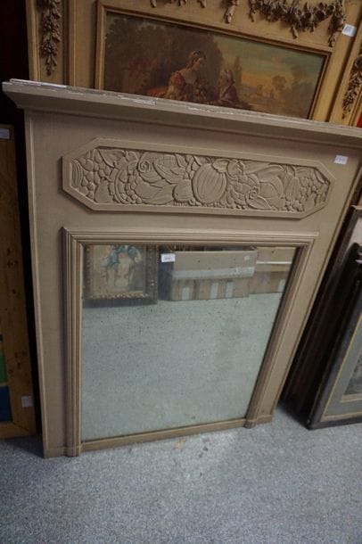 A molded and carved wood trumeau, beige lacquered,...