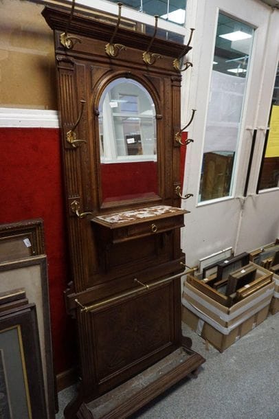 A moulded wooden entrance cabinet, the console...