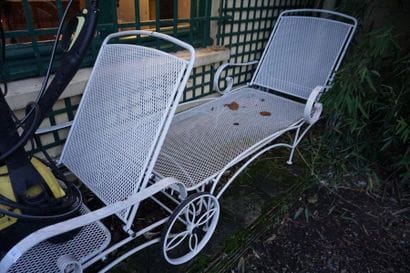 *Pair of painted metal deck chairs on wheels....