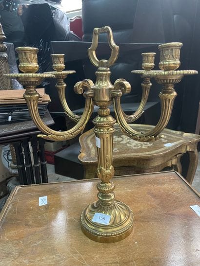 Candélabre en métal doré à quatre bras de...