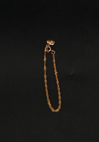 Bracelet en or 18K (750) retenant un cœur....