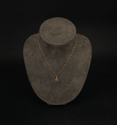 Chaîne de cou en or 18K (750) orné d'un pendentif...