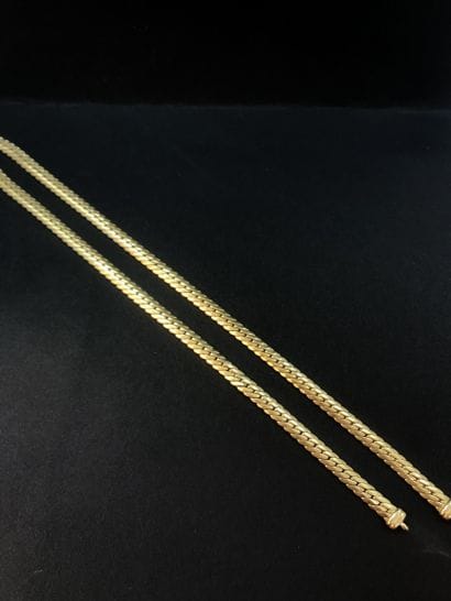 Collier, or 18k (750) à mailles entrelacées....
