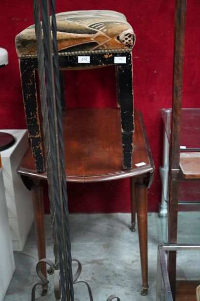Deux lampadaires tripodes en fer forgé ;...