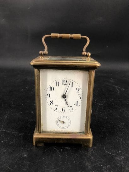 Pendulette d'officier en laiton. En l'ét...