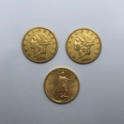 Trois pièces en or de 20 dollars américains...