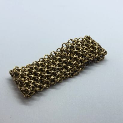 Bracelet draperie en or 18K à décor de demi-sphères...