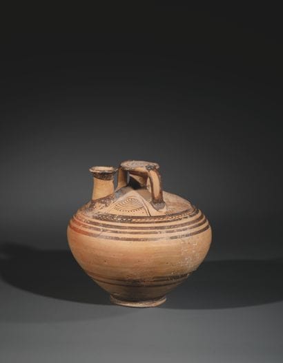 STEEL JAR
Adorned with a pair of concentric...