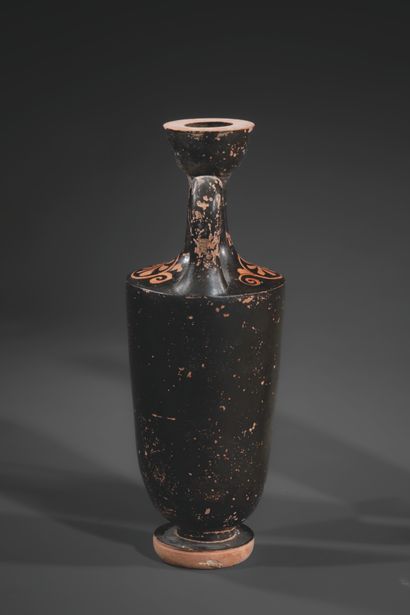 RED-FIGURE LEKYTHOS
The body features a woman...