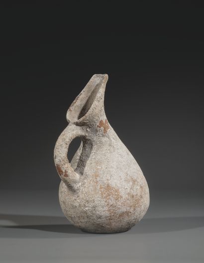 REVERSE SPOUT JUG
Pyriform body, neck decorated...