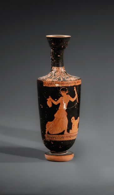 RED-FIGURE LEKYTHOS
The body features a woman...