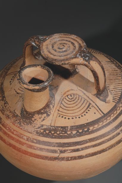 STEEL JAR
Adorned with a pair of concentric...