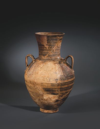 GEOMETRIC AMPHORA
Light brown, buff-colored...