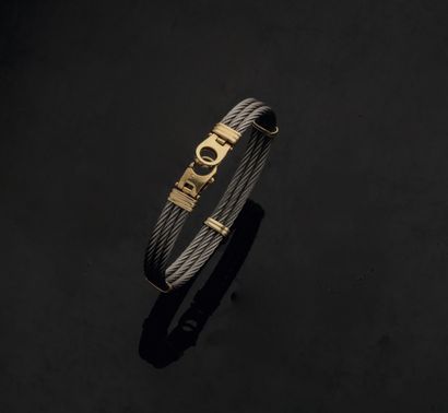 BRACELET
Three twisted steel cables, held...