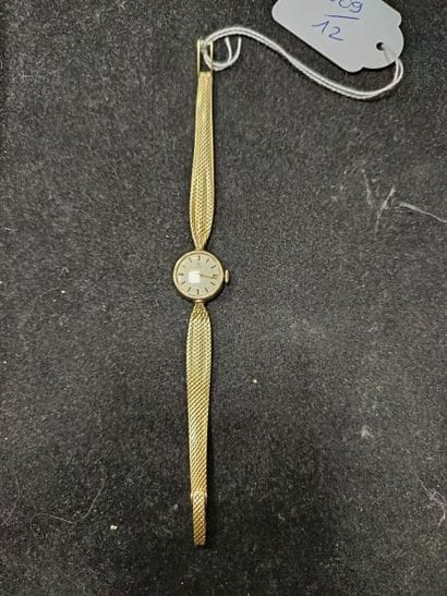 TISSOT
Montre bracelet de dame en or 14K...