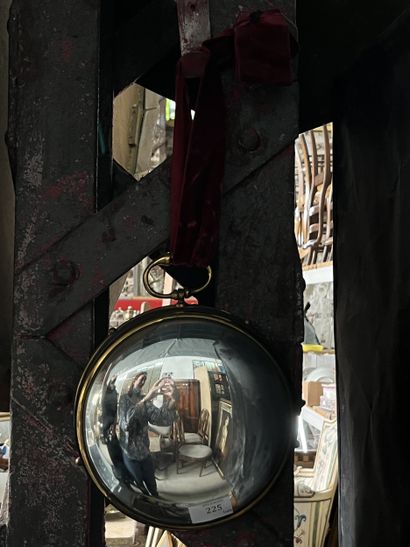 Miroir sorcière en métal doré et cuir
en...