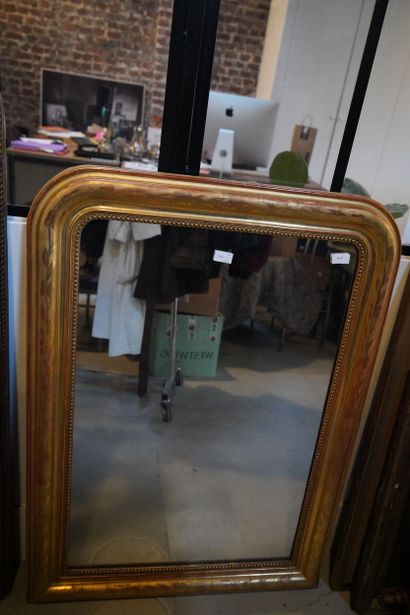 Miroir ceintre en bois et composition dorée,...
