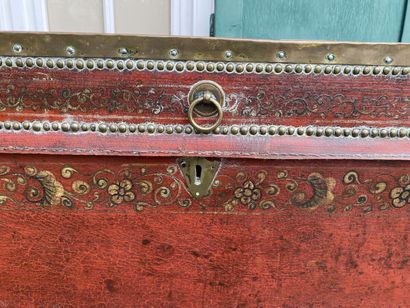 Wooden chest covered with studded burgundy...