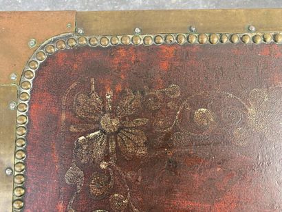 Wooden chest covered with studded burgundy...