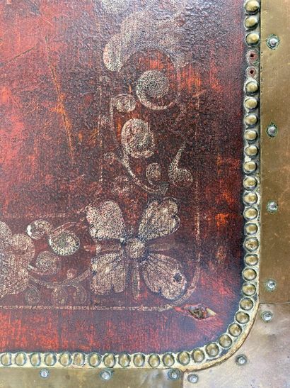 Wooden chest covered with studded burgundy...