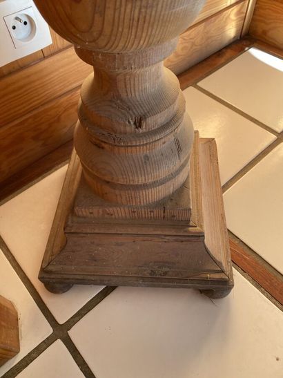Sellette of baluster form in pitchpin. 
Height...