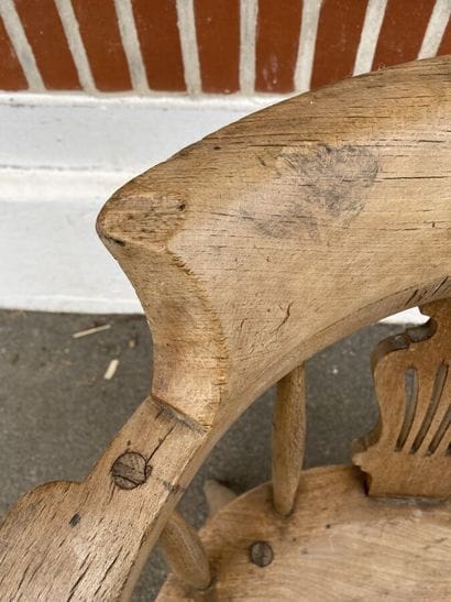 Armchair in natural wood, openwork back decorated...