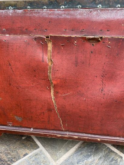 Wooden chest covered with studded burgundy...