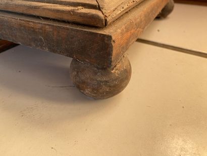 Sellette of baluster form in pitchpin. 
Height...