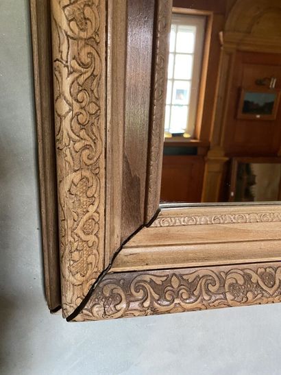 Mirror with natural wood frame, carved with...