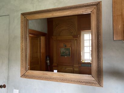 Mirror with natural wood frame, carved with...