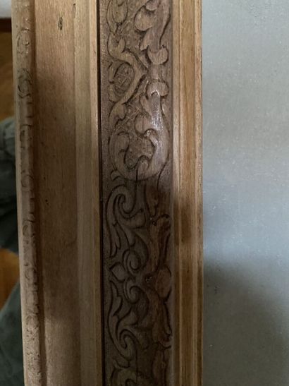 Mirror with natural wood frame, carved with...