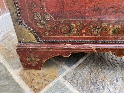 Wooden chest covered with studded burgundy...